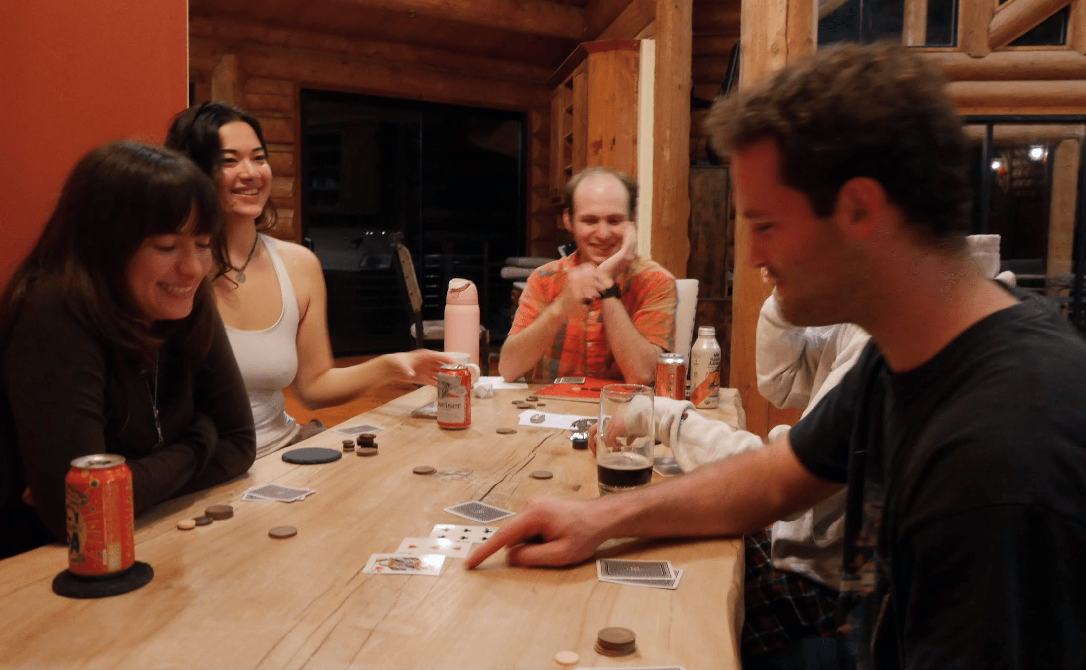 Team seated around a table playing a card game