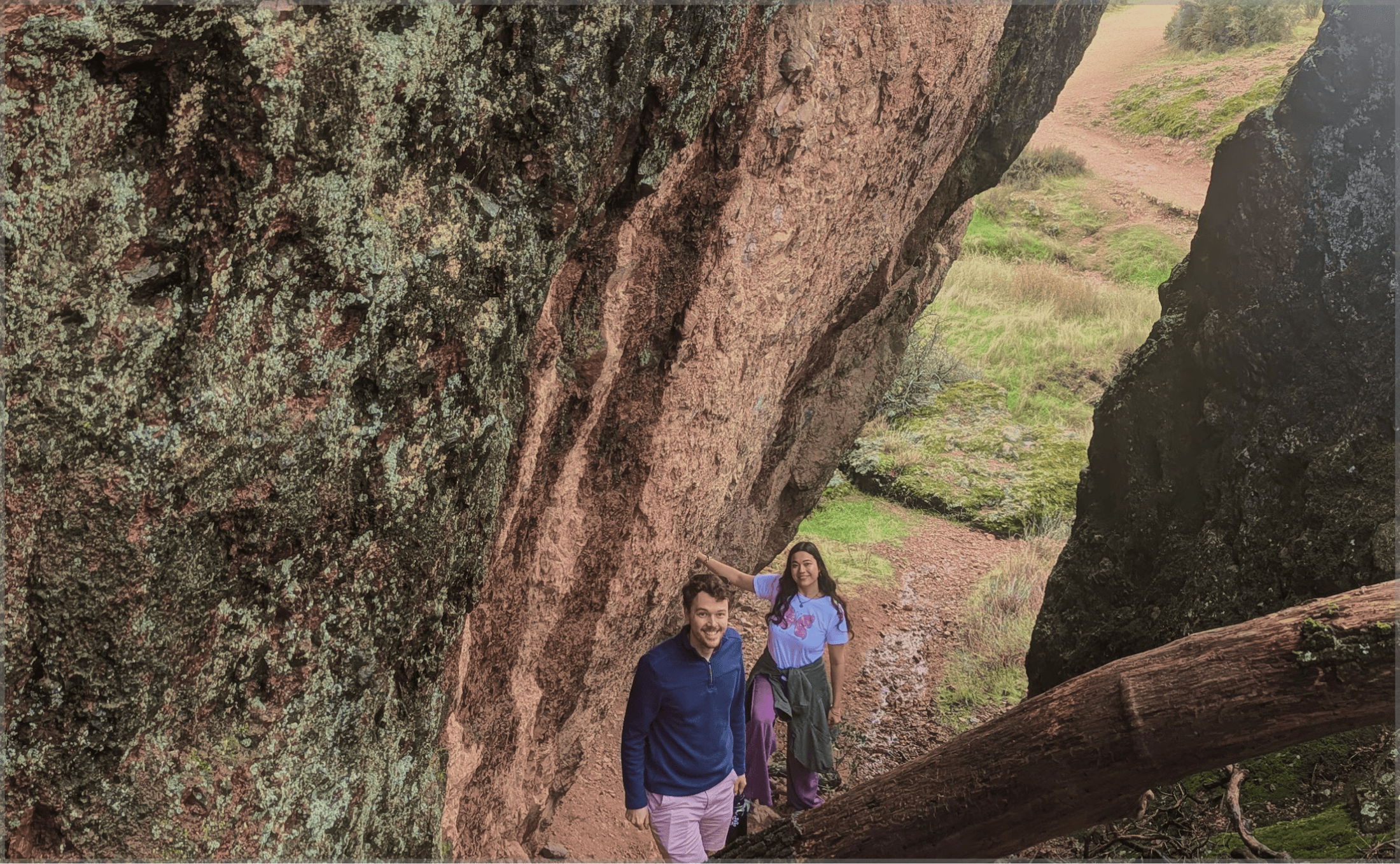 Reese and Yana hiking between large rocks